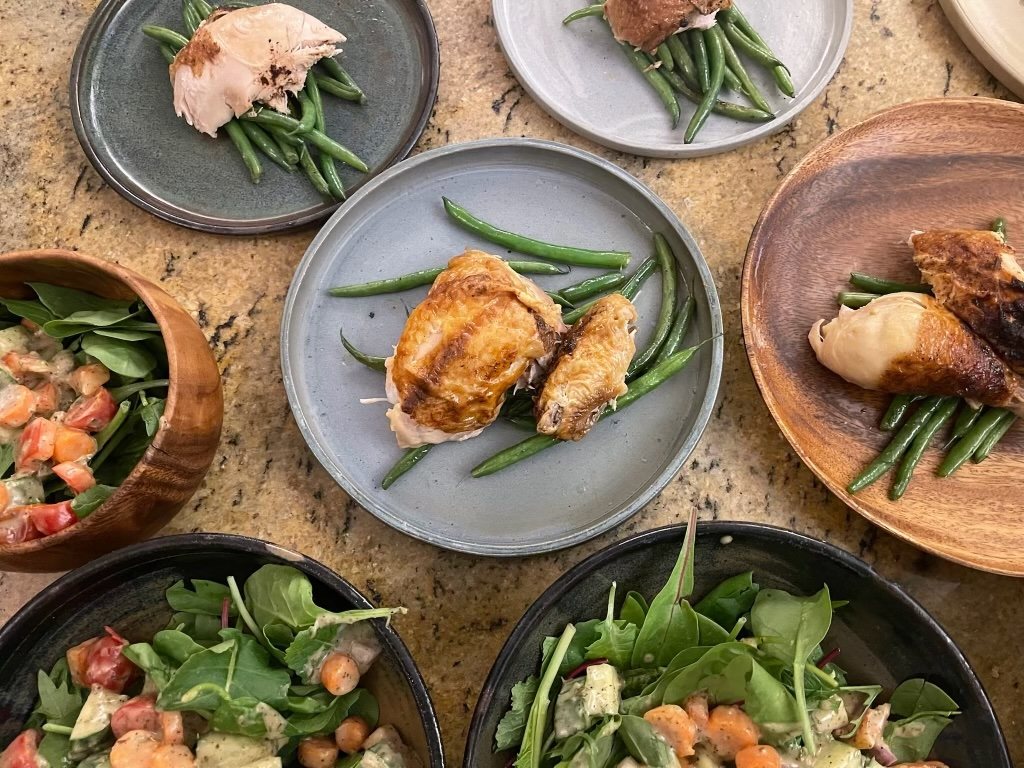 A spread of fresh, seasonal whole foods on a wooden table